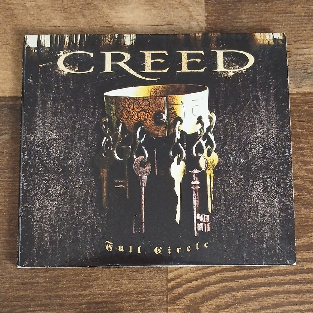 Creed Full Circle Album with Gold and Black Design